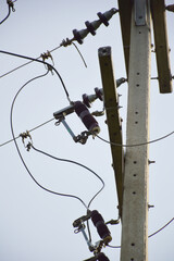 power lines on the pole against the backdrop of the sky
