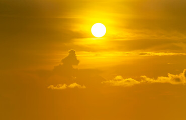 Spectacular sunrise on the horizon with the sea at your feet. Romantic sunrise. Beach sunrises. The sun tries to rise through the clouds in the orange sunrise. Travel and landscape concept.