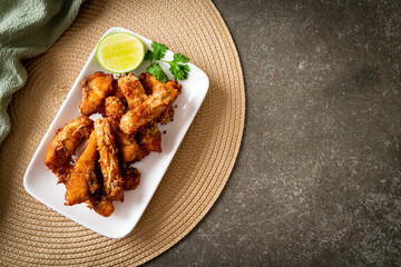 Fried Snapper Belly on white plate
