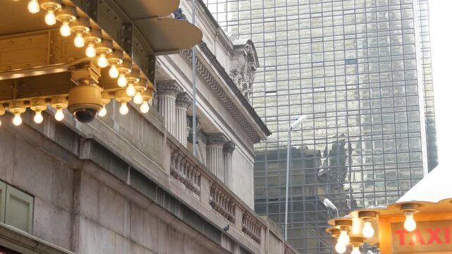 New York City, American Grand Central Terminal railway station building, 42 street. Manhattan Midtown. Yellow taxi kiosk, telephone call box with bulb lights on Pershing Square, NYC, USA. Pigeon bird.