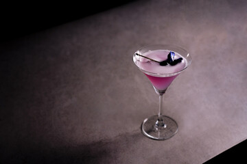 Elegant Purple Cocktail with Foam and Edible Flower Garnish
