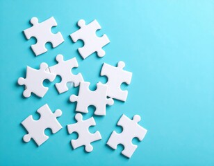 Obraz premium White jigsaw puzzle pieces scattered on bright turquoise blue background representing teamwork, problem solving and business solutions concept.