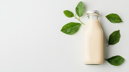 Fresh bottle of milk elegantly presented with a green leaf adding a touch of nature and organic appeal to the scene