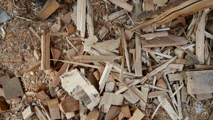 Fire starters and sawdust for lighting firewood, carpentry material background