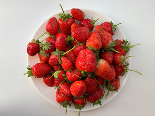 A full plate of strawberries	
