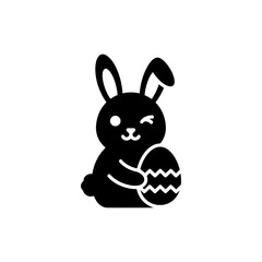 Bunny Winking While Holding a Decorative Easter Egg