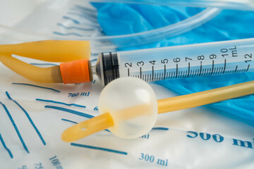 Foley catheter and urine drainage bag collect urine for disability or patient in hospital.