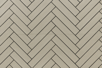 Modern Herringbone Patterned Wall with Neutral Tones and Clean Lines