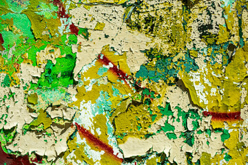 Abstraction of crumbling graffiti on a city street wall. Colorful abstract background. Old,...