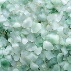 Close-up of green mineral crystals on a textured background.