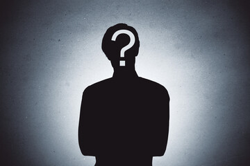 Silhouette of person with question mark on face symbolizing mystery, curiosity, or identity concept on textured gradient background.