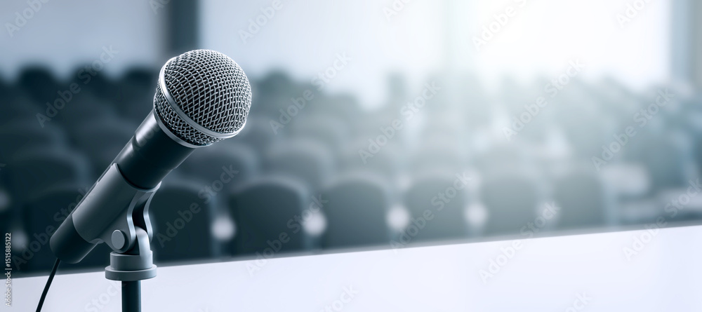 Poster Closeup of microphone on stage in empty conference room with soft blur and ambient light in background, symbolizing presentation scene. 3D Rendering