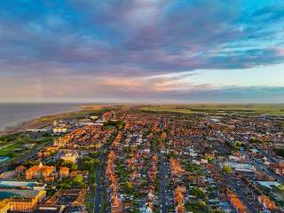 Fototapeta premium Sunset Aerial Panoramic View of the UK Seaside Skegness, a busy tourist town with something for everyone, from stunning campsites to a sunset to die for, showcases the beauty serene sunset. June 2025