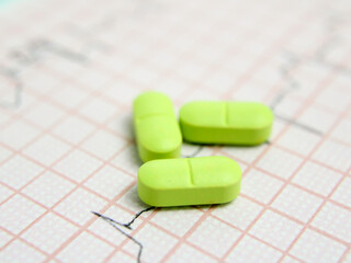  Medical green pills. A diagram symbolizing heart health and well-being