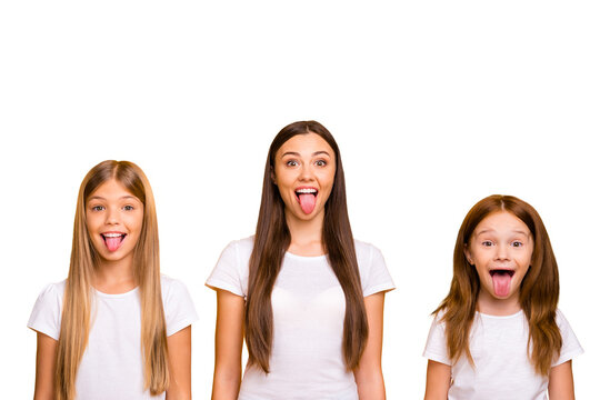 Fototapeta Photo of three different age ladies fooling around together wear casual white t-shirts isolated yellow background