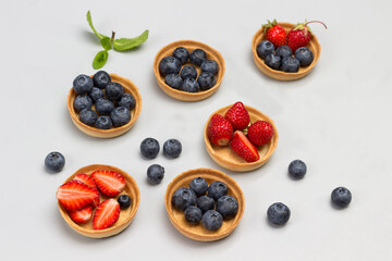 Blueberry and strawberry tartlets.