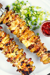 Tasty grilled meat skewers with potatoes.