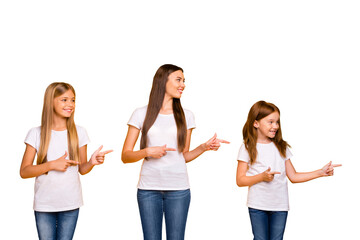 Naklejka premium Photo of charming ladies indicating fingers side empty space wear casual clothes isolated yellow background