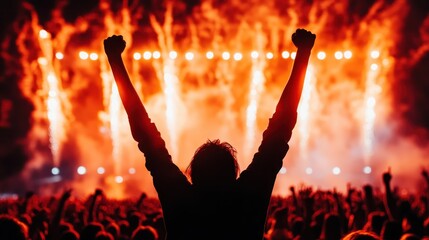 A crowd enjoys an electrifying moment at a music festival, arms raised in exhilaration, while bright fireworks illuminate the night sky, creating an unforgettable atmosphere.
