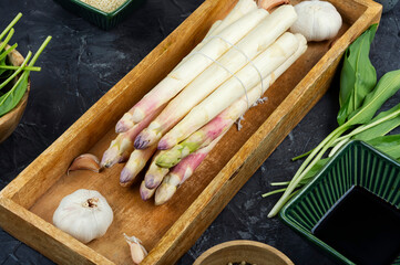 Freshly raw white Asparagus with violet head