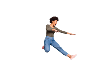 Full length photo of dark skin pretty wavy lady jumping high dancing modern youngster moves wear casual outfit isolated pastel blue color background