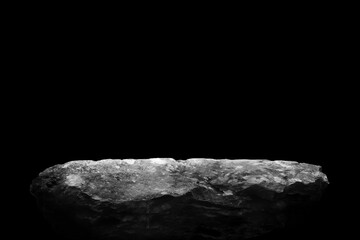 Stone podium on dark black background..