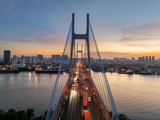 Stunning view of Phu My bridge at sunset over the Saigon River in Ho Chi Minh City, Vietnam
