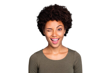 Close up photo of cheerful candid afro american girl wink blink have free time with her friends wear green casual clothes isolated over blue color background