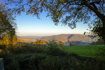 View from a hill of Lake Rur in the Eifel region and the surrounding landscape. Nature in the...