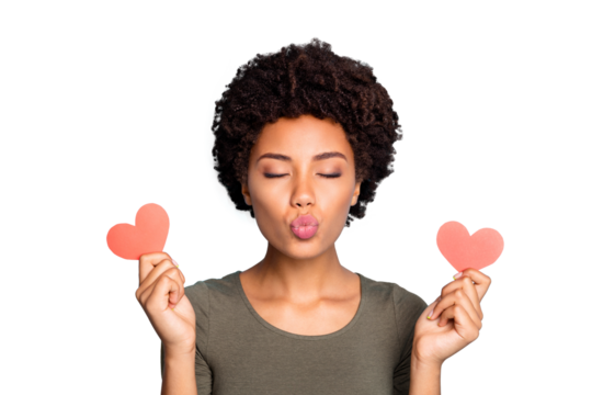 Close up photo of dreamy flirty dark skin girl hold little red paper card heart for 14-february have date with boyfriend send air kiss wear green trendy pullover isolated over blue color background