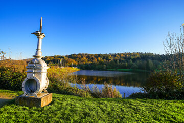 View of the Eiserbachsee lake in Rurberg near Simmerath. Landscape at the Eiserbach dam. Nature in the Eifel region.
