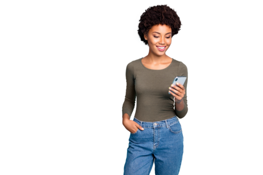 Photo of cheerful cute nice attractive black woman wearing green sweater standing confidently with her hand in pocket smiling cheerfully isolated over vivid blue color background