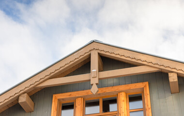 Architectural detail of a house rooftop featuring wood construction