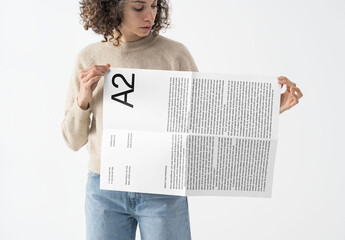 Mockup Of Woman Holding Customizable Horizontal A2 Poster