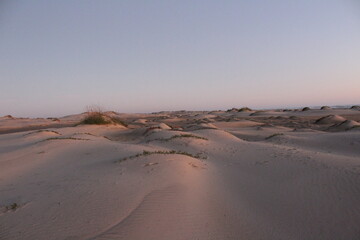 sunset over sand dunes