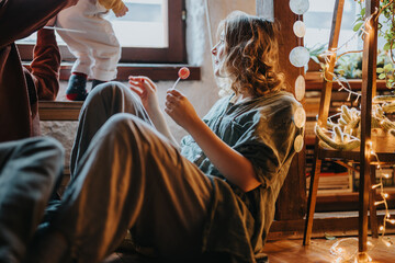 A serene moment featuring a family enjoying simple joys and bonding in a comfortable, homey atmosphere filled with natural light and personal touches.