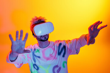 Young man explores virtual reality in a vibrant, colorful setting with immersive technology