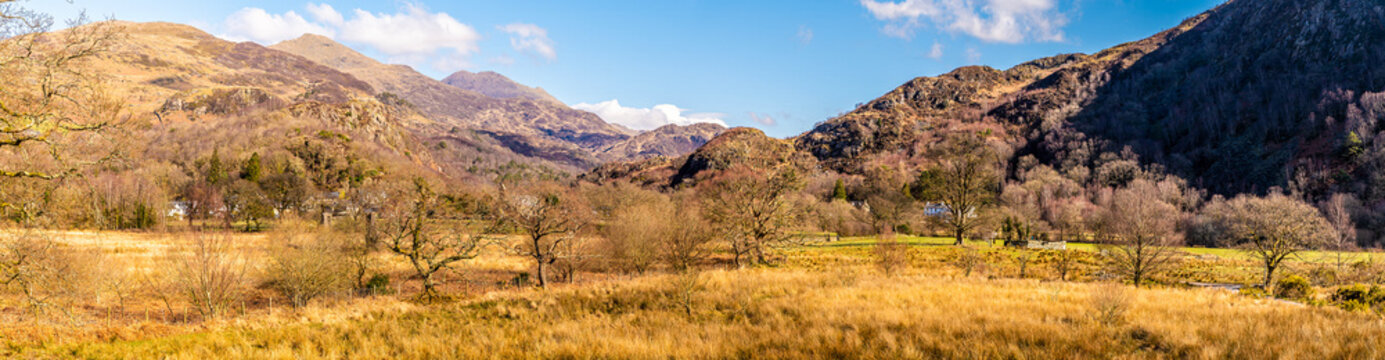 A panorama view across fields in the foothills of Snowdonia at Beddgelert, Wales in springtime