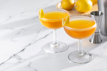 Paper plane cocktail on white marble background. Copy space