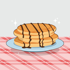 Stack of three pancakes covered in chocolate syrup on a blue plate set on a red  white checkered tablecloth