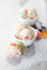 Milk yogurt and jelly ice cream in a white bowl.