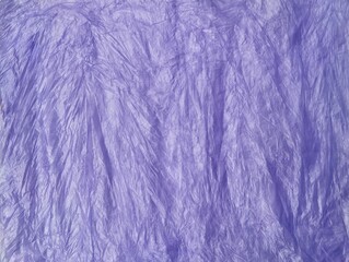 Abstrack purple crumpled plastic bag texture background 