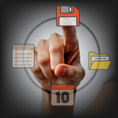 hand pushing a button on the touch screen interface