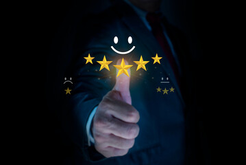 Business man or customers show satisfaction through the application on the tablet screen. Customer service evaluation, Satisfaction survey concept. giving satisfaction rating and 5 star.