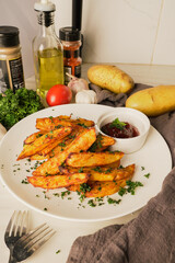Tasty of baked potatoes with paprika and garlic, topped with fresh parsley and rich tomato sauce an irresistible homemade dish served fresh from the oven.