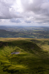 View of Llyn Cwm Llwch from Pen y Fan in summer in the Brecon Beacon or the Bannau Brycheiniog national park, Powys, Wales
