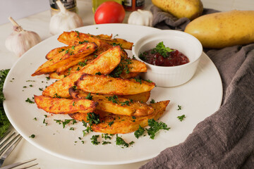 Tasty of baked potatoes with paprika and garlic, topped with fresh parsley and rich tomato sauce an irresistible homemade dish served fresh from the oven.