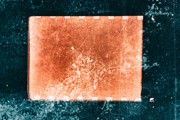 Background with original 35mm film reel with empty dusty frames or cells and nice texture on the border, copy space