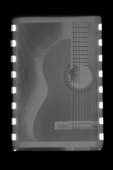 Contact sheet of old black and white film negatives with classic guitar. cinematic art
