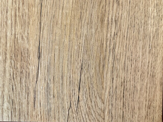 Fototapeta premium Close up of light beige solid wood texture. Natural light wood with its rustic dark veins on it. Suitable for wood flooring and table top. Seamless background texture